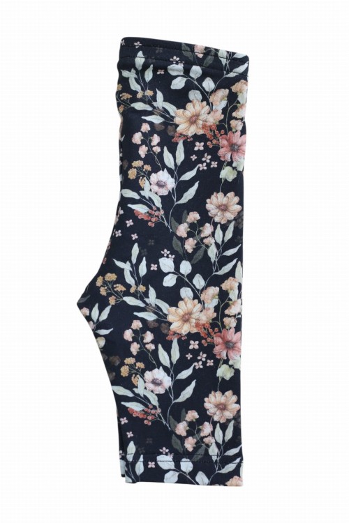 Legginsy Meadow – kwiatowy wzór na czarnym tle, ułożone na płasko